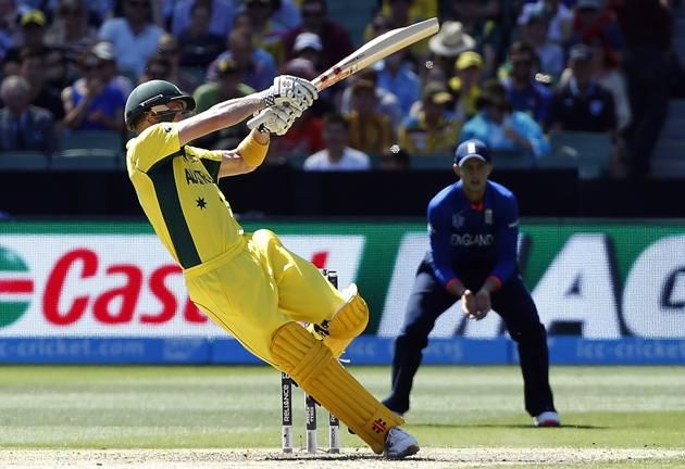 Australia's captain George Bailey falls over as he plays a shot during the Cricket World Cup match against England at the Melbourne Cricket Ground